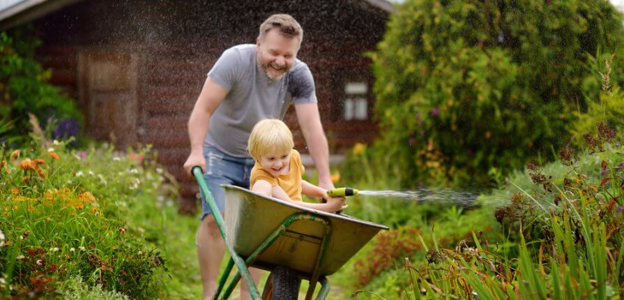 How To Get Your Kids Gardening This Summer - Dad and son gardening